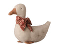 Duck with bow, sand